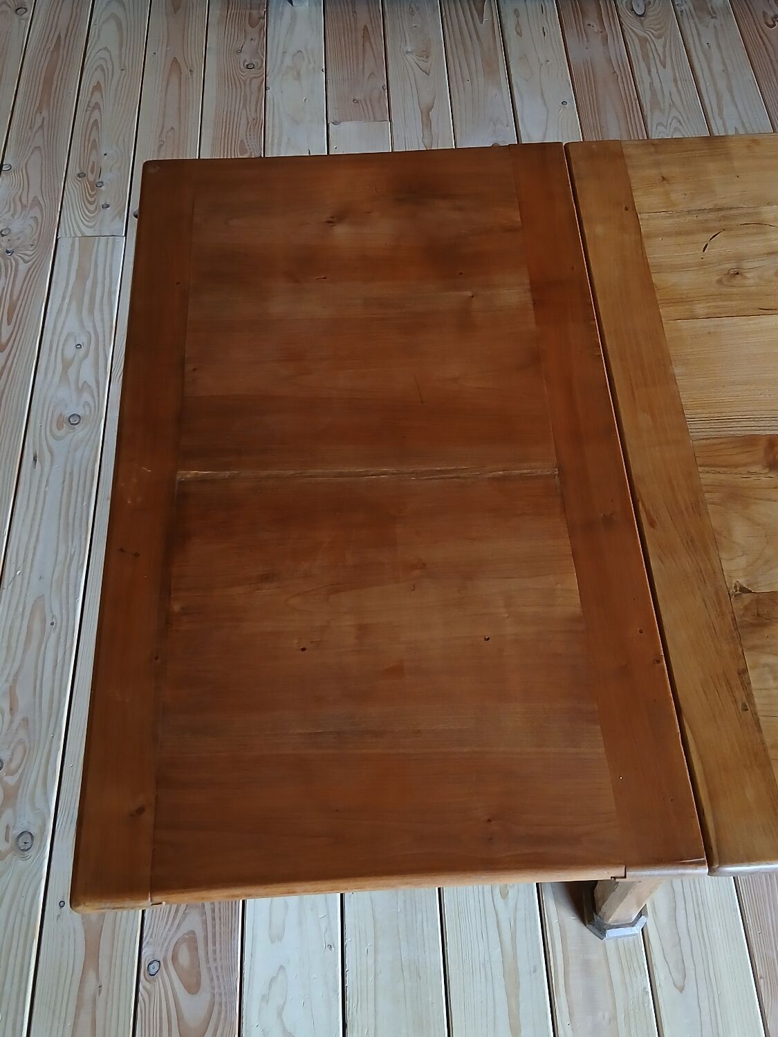 Elm farmhouse table with extensions for 6 to 10 people.