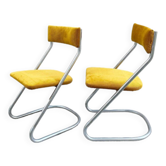 Pair of chrome cantilevered chairs with yellow corduroy seat