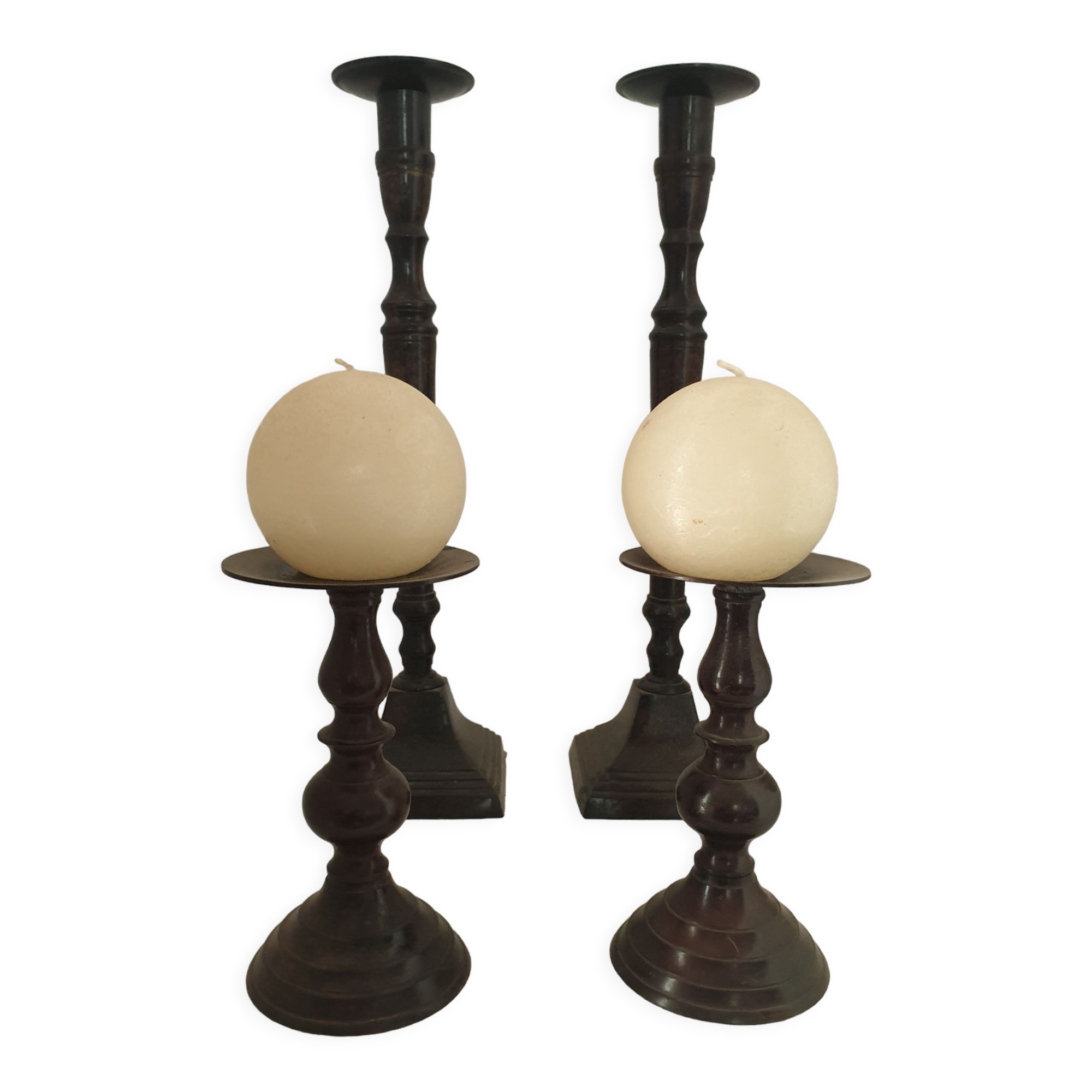 Two pairs of patinated brass candle holders