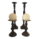 Two pairs of patinated brass candle holders