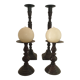 Two pairs of patinated brass candle holders
