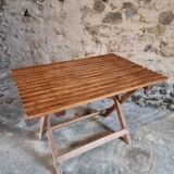 Vintage folding garden table in pine, mid-20th century.