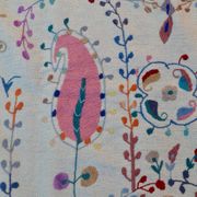 White suzani kilim rug with hand embroidered multi-colored patterns