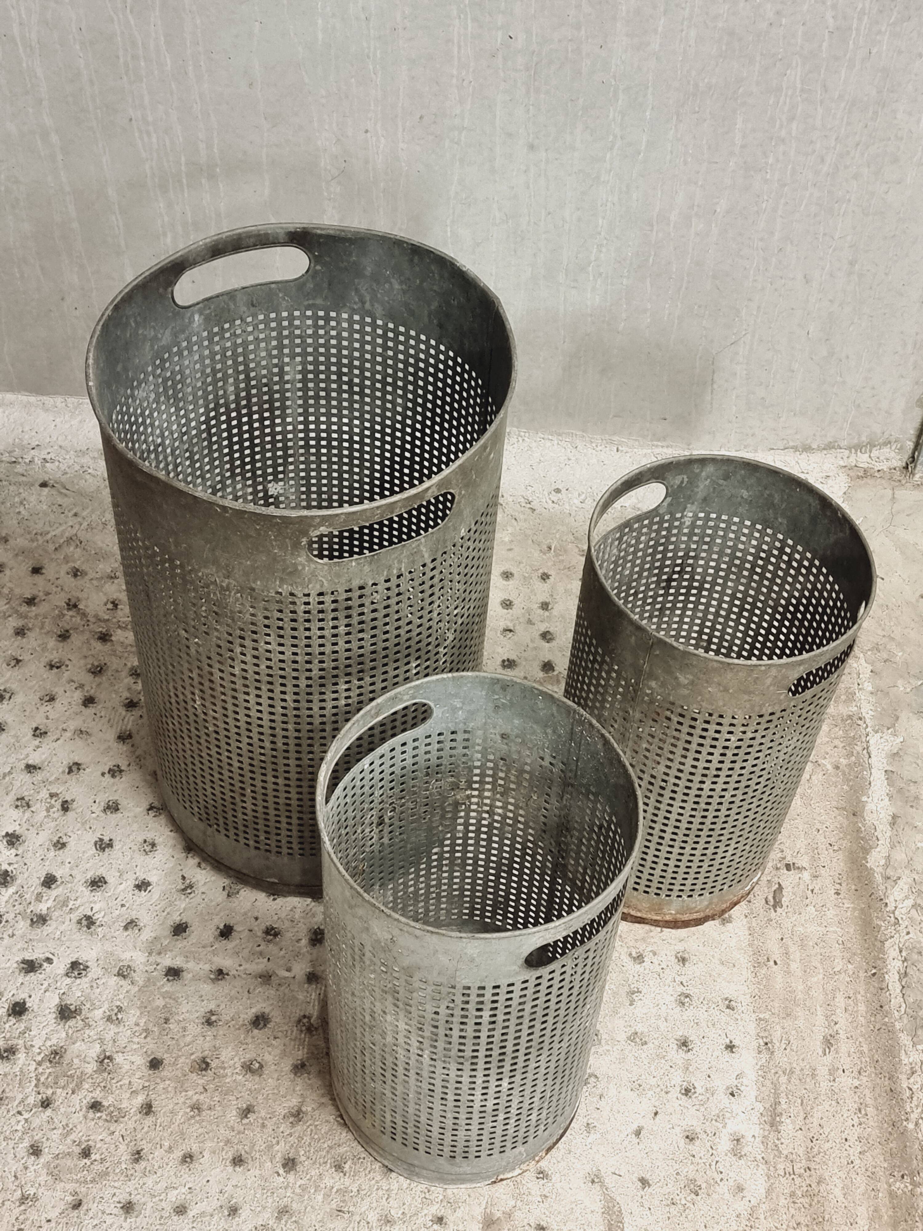 Vintage set of perforated metal waste bins