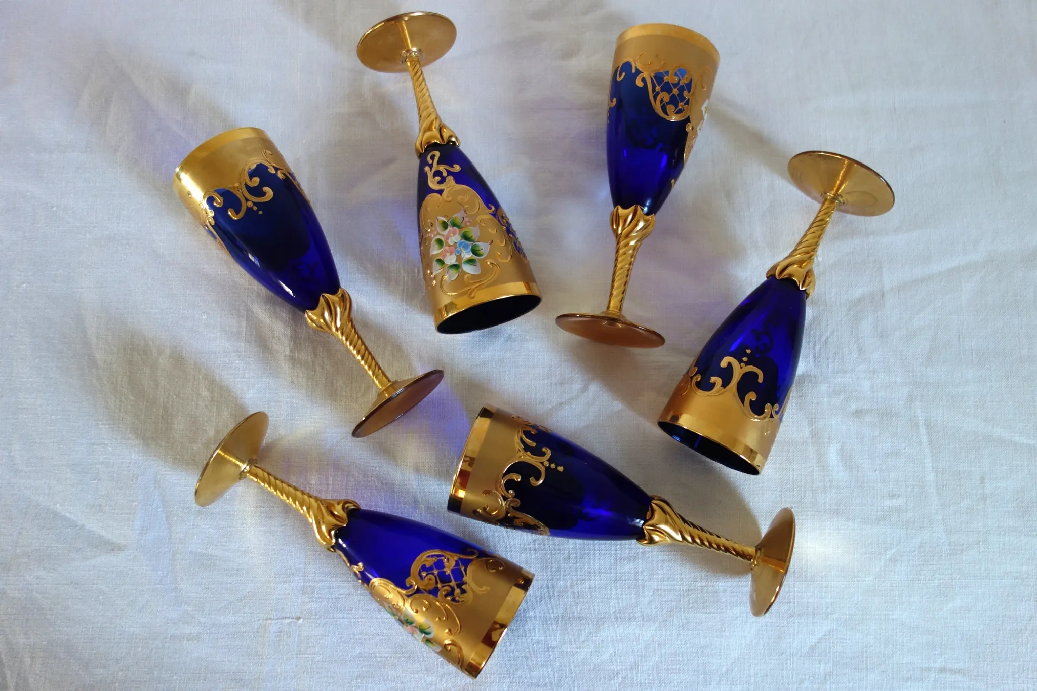 12 cobalt blue and gold Murano glass flutes, mid-20th century.
