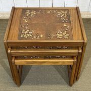 Set of 3 nesting tables in teak with tiled tops.