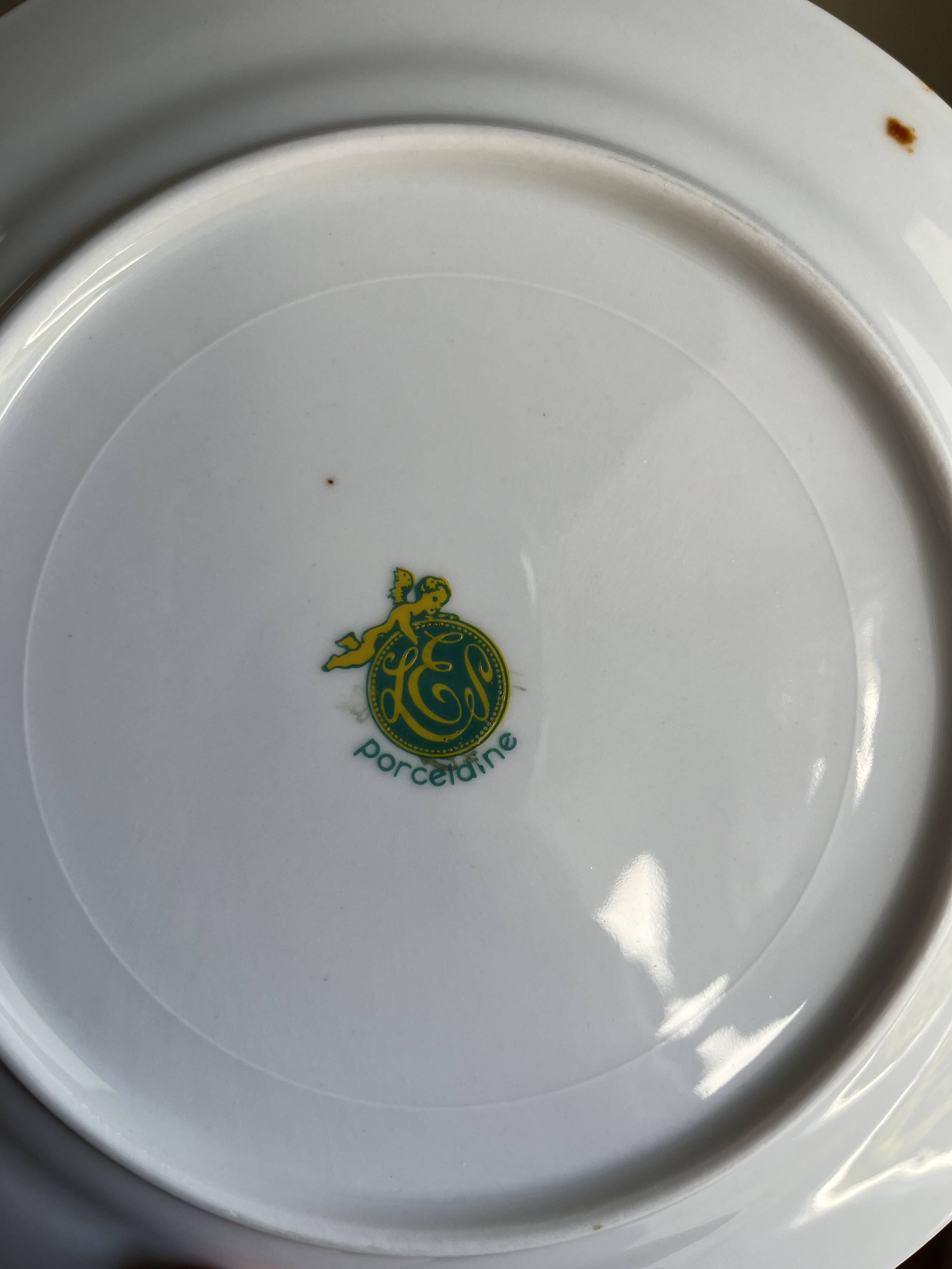 12 white porcelain plates with silver edging