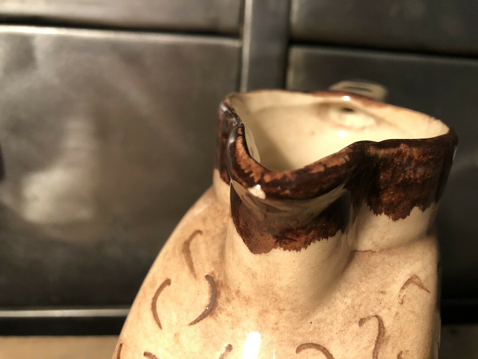 Ceramic pitcher with floral decoration signed Lucq