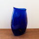 Blue blown glass vase and orange inclusion