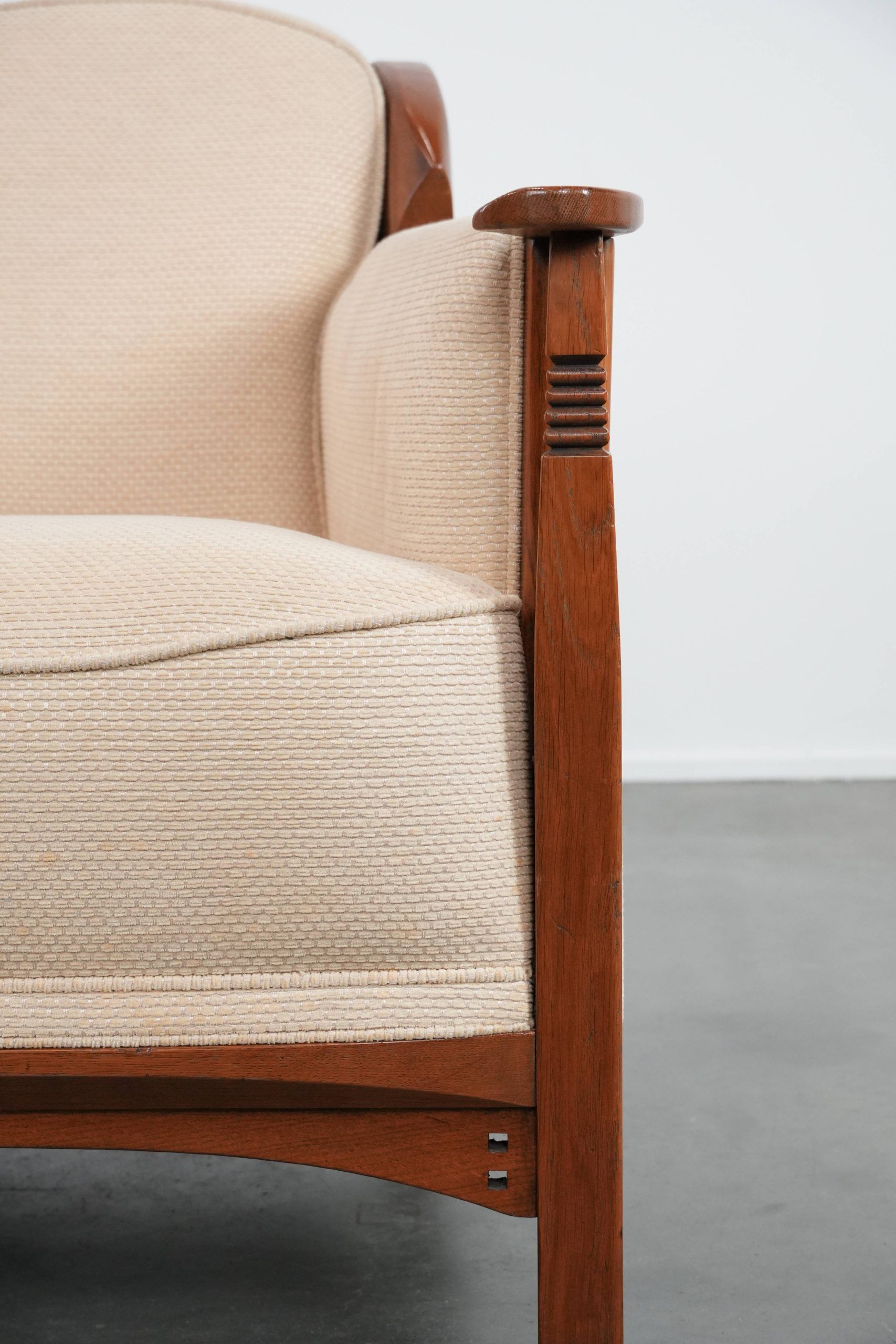 Art Nouveau design armchair with a luxurious light fabric upholstery