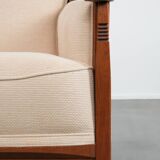 Art Nouveau design armchair with a luxurious light fabric upholstery