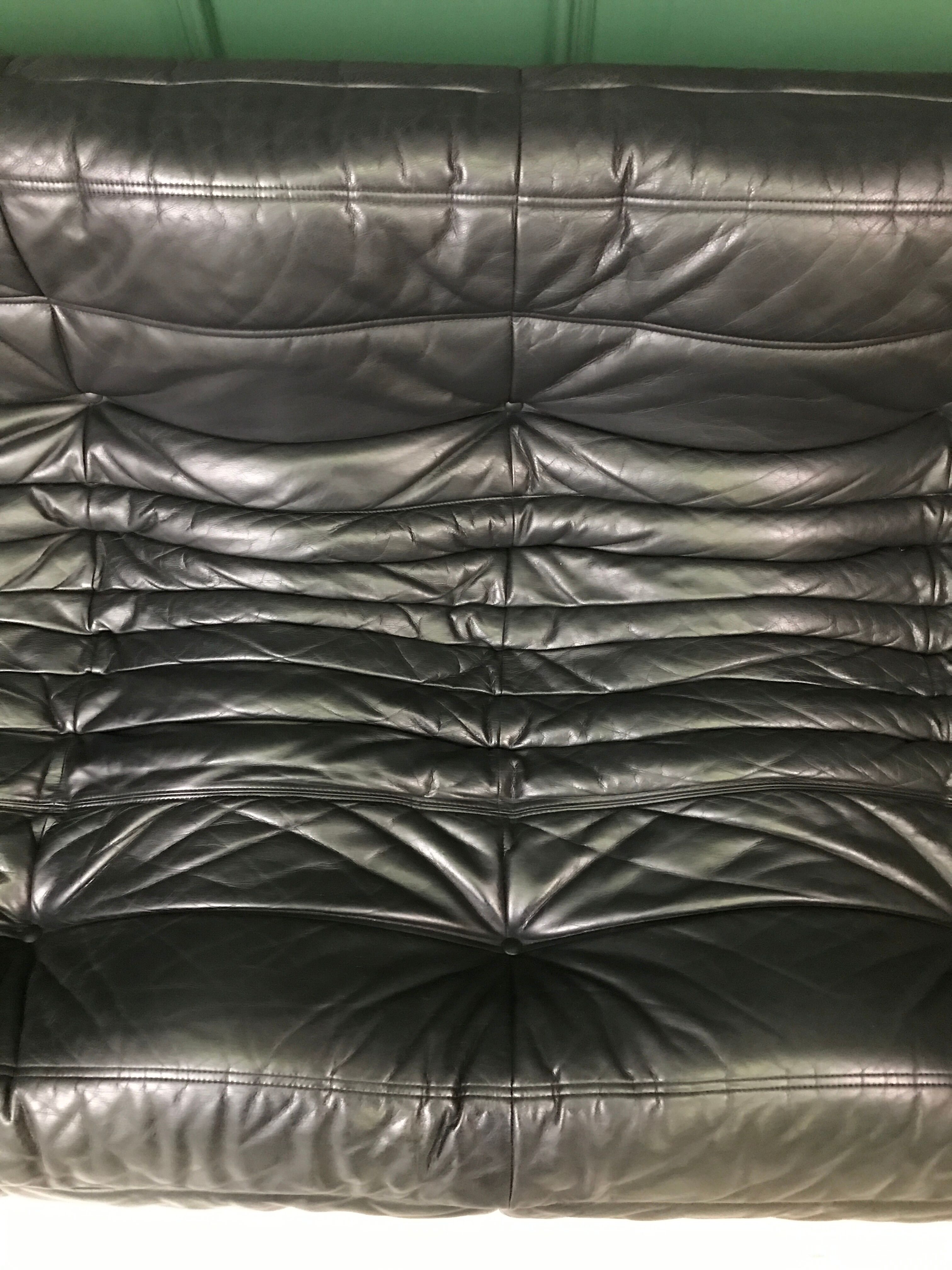 Black leather three seater sofa Togo by Ligne Roset