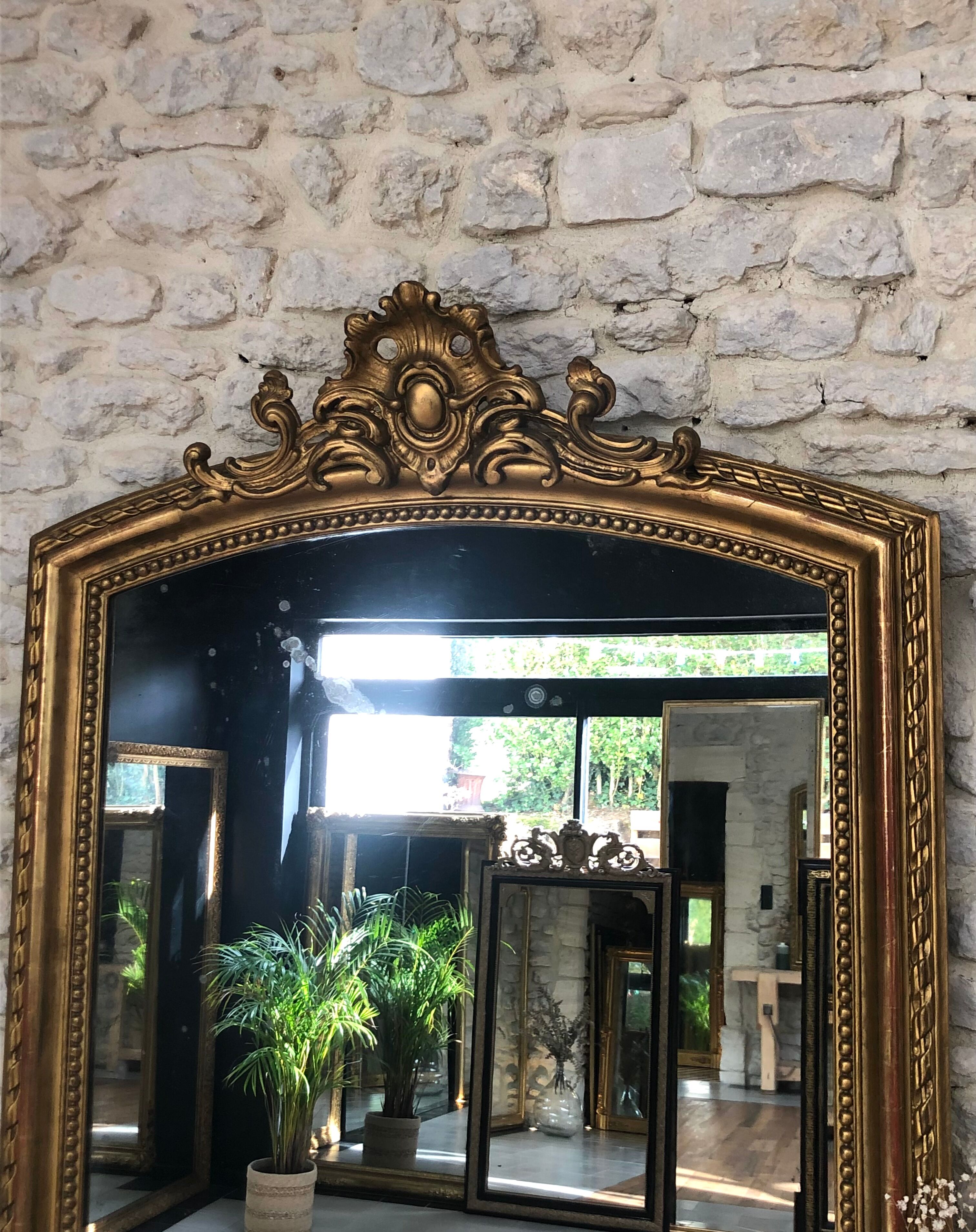 Old mirror 139cm/ 91cm Louis-Philippe with pediment period early 19th, presence of gold leaf.