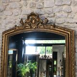 Old mirror 139cm/ 91cm Louis-Philippe with pediment period early 19th, presence of gold leaf.