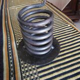 Spiral metal candle holder spring with candle, bronze appearance
