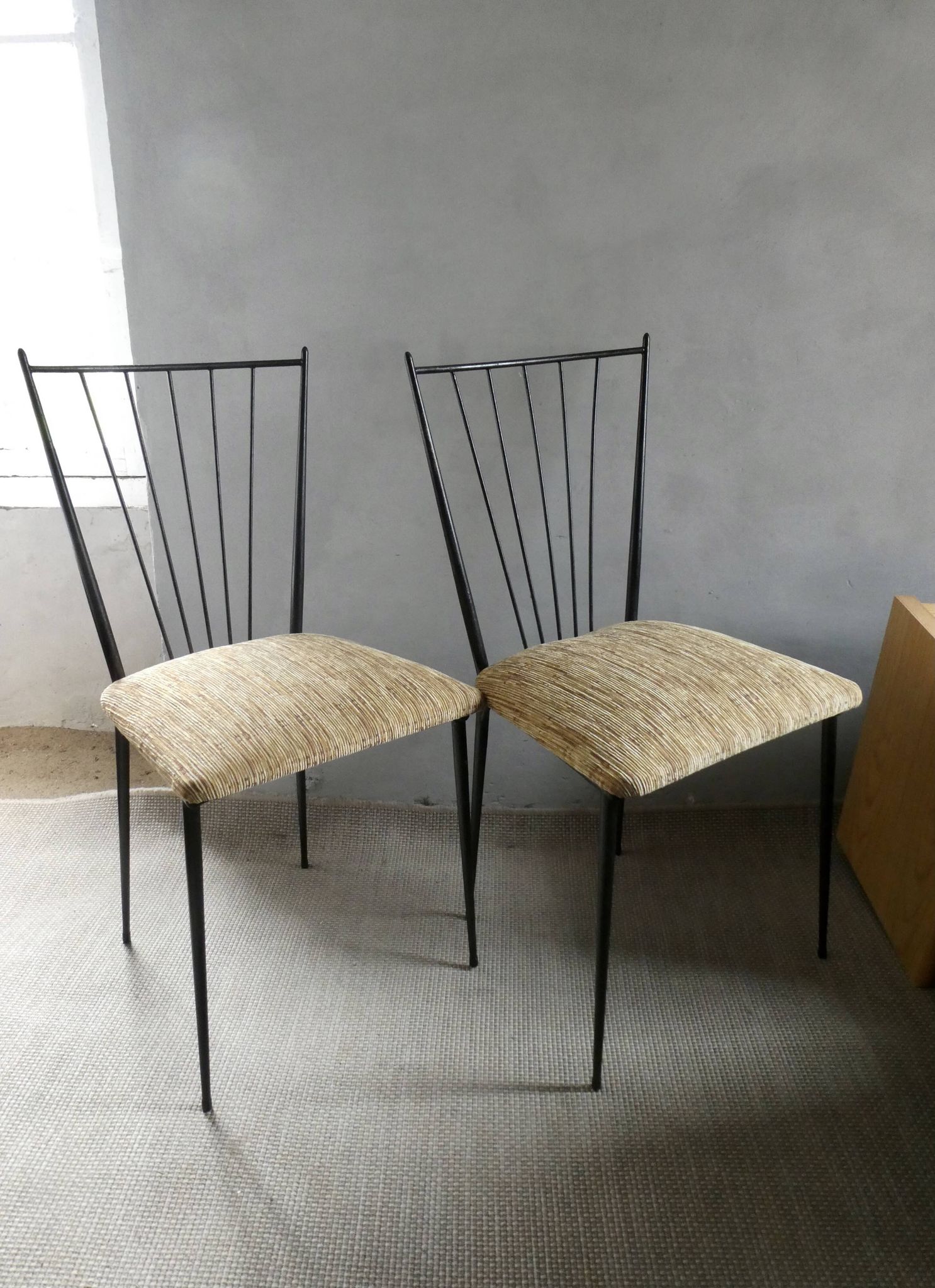 Pair of Colette Gueden chairs, black metal and fabric.