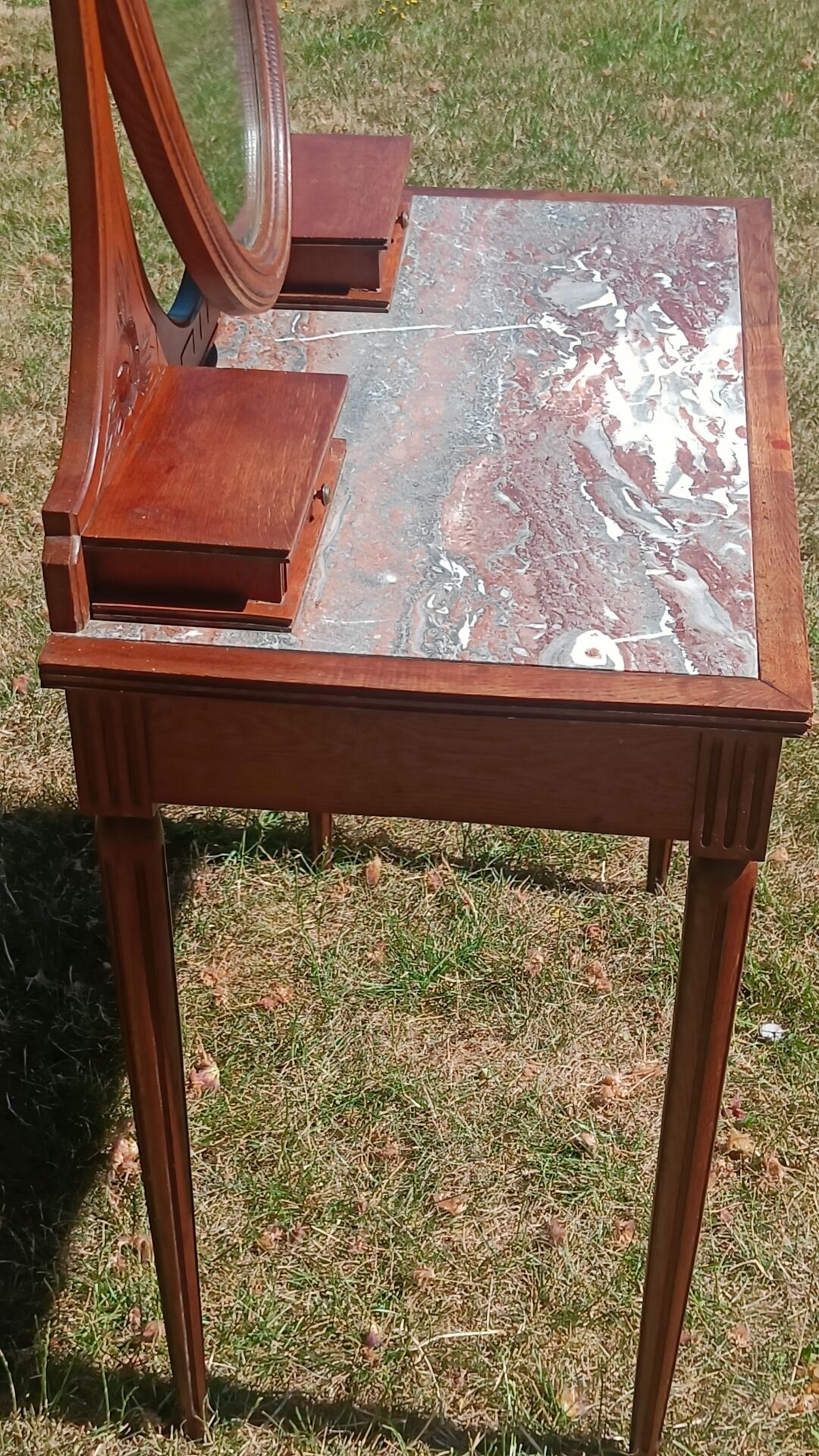 Art Deco oak dressing table, marble top and swivel mirror.