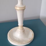 Candle holder on his tin cup
