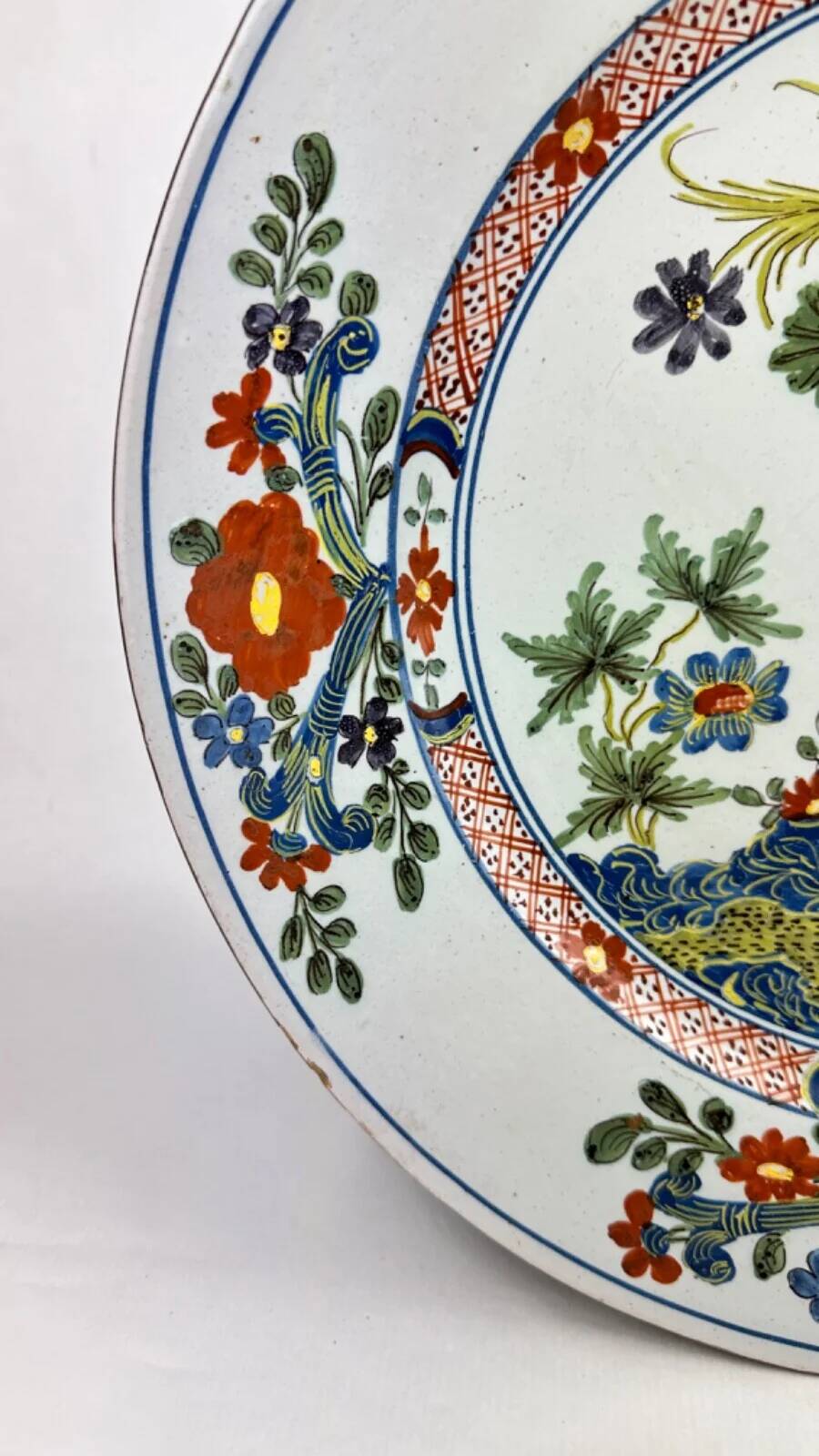 Delftware plate with gilded highlights, relief decoration, 18th century, 35 cm
