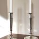 Pair of silver-plated metal candelabra decorated with hunting horns