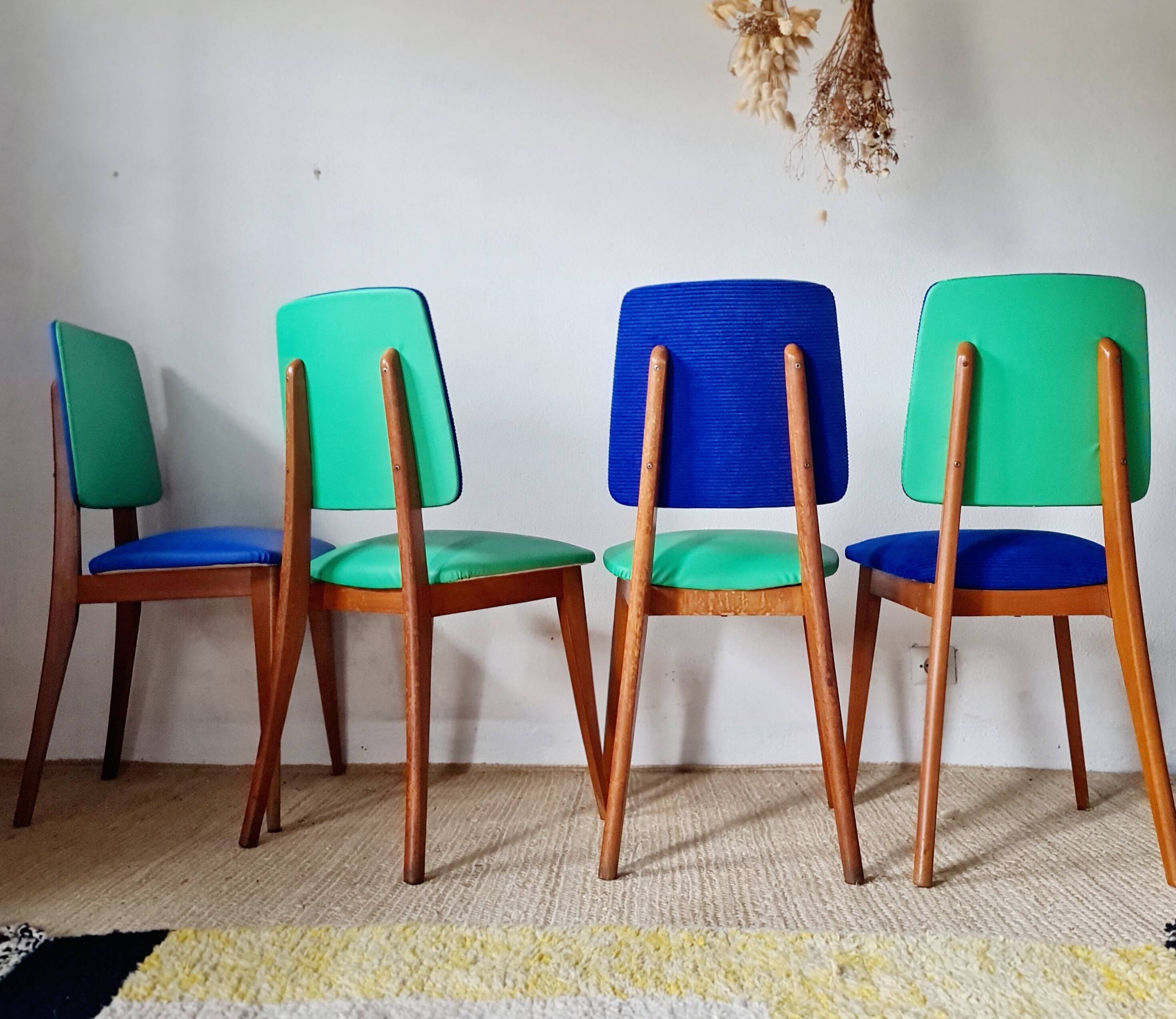 Series of velvet Scandinavian chairs - green and blue.