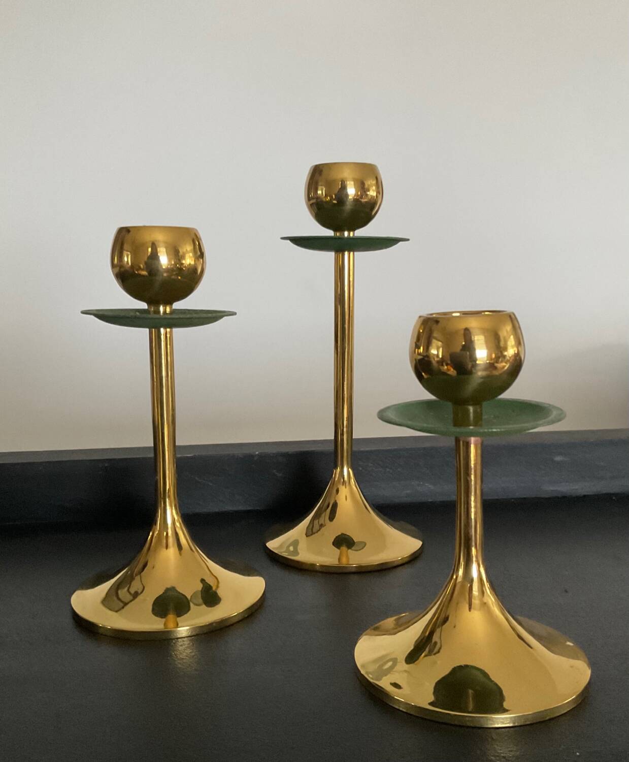 Trio of vintage brass candlesticks