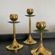 Trio of vintage brass candlesticks