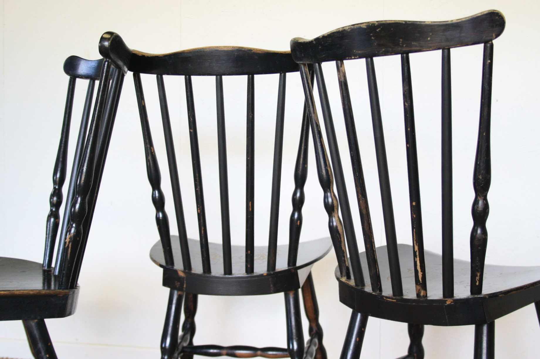 Three black Baumann bistro chairs