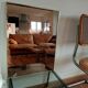 Vintage mirror in gilded brass and smoked glass. circa 1970