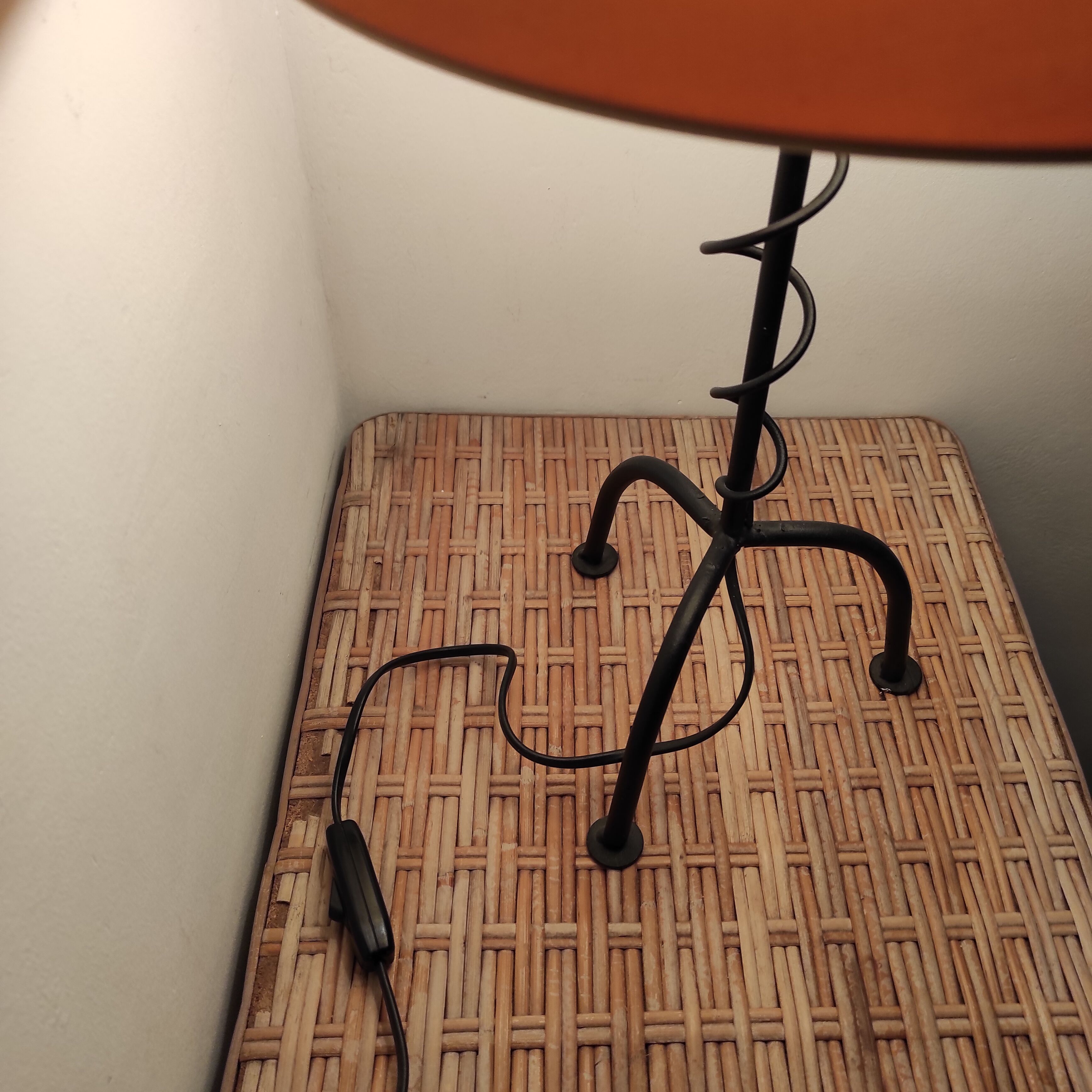 Black wrought iron table lamp and beige lampshade