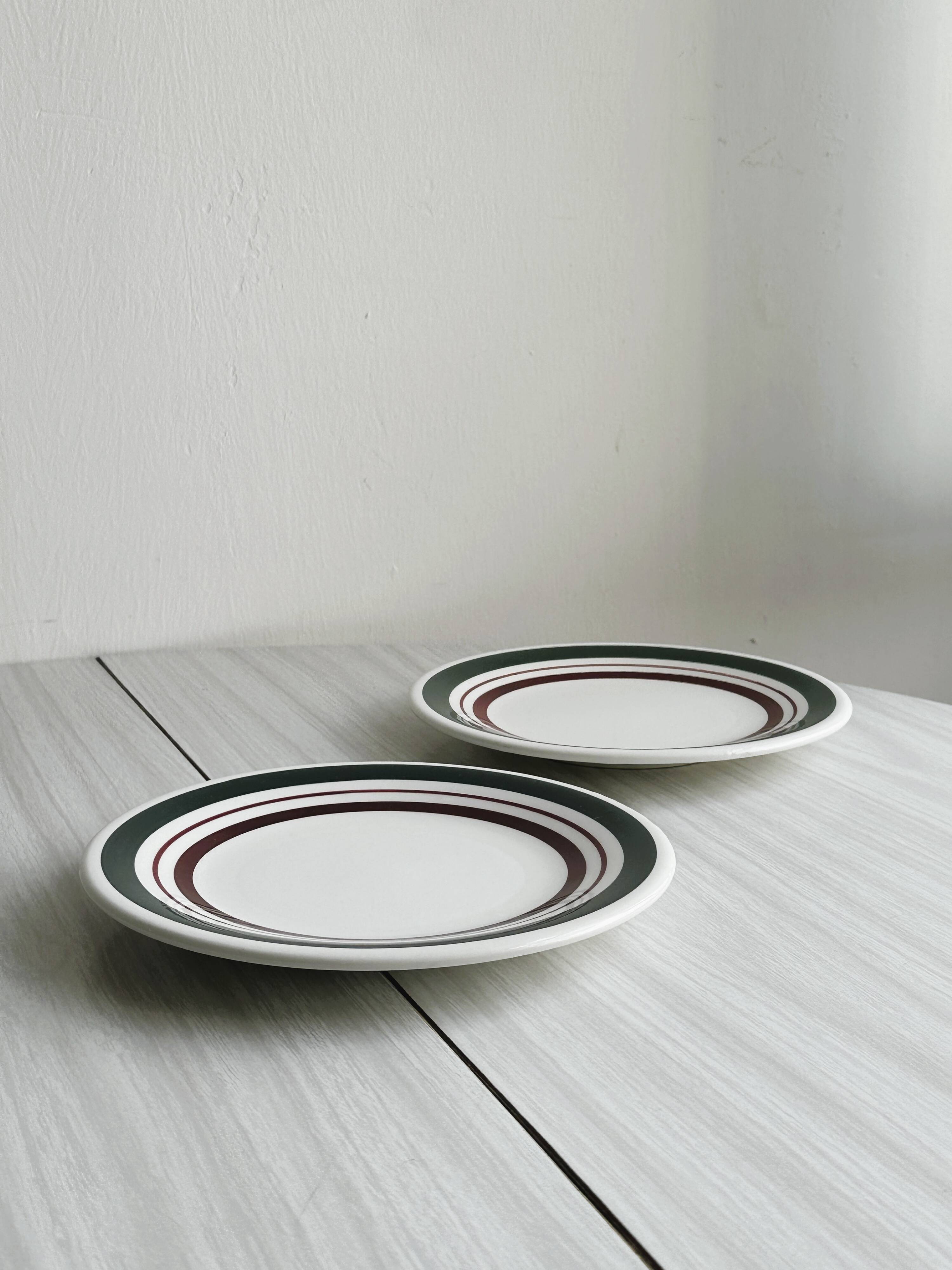 2 green and burgundy strip dessert plates.