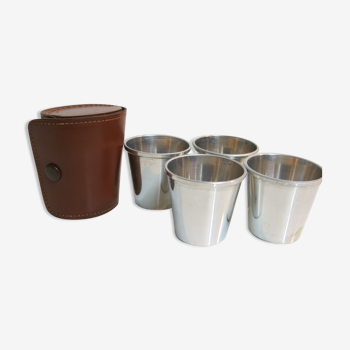 Four silver shot glasses and their leather sleeve