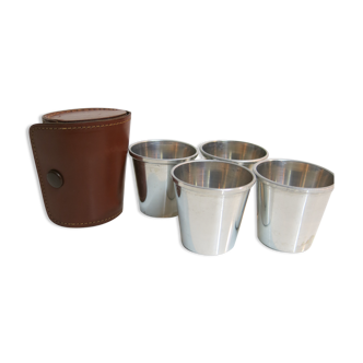 Four silver shot glasses and their leather sleeve