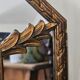 Bevelled mirror with neoclassical parcloses from the 20th century.