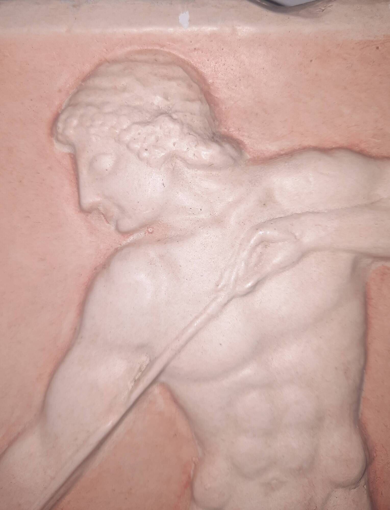 Bas-relief in the antique style featuring athletes.