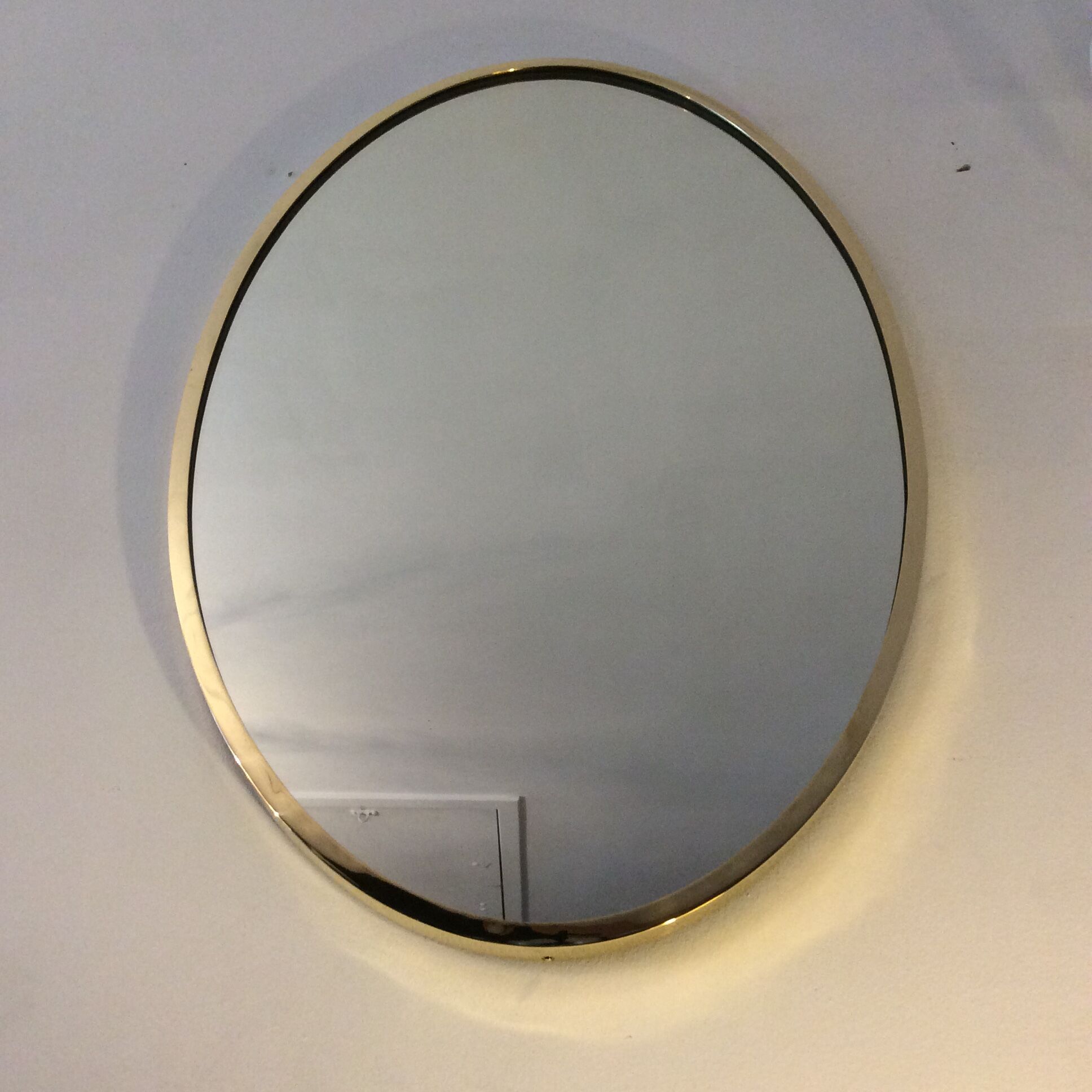 Belgo Chrom oval mirror from the 70s in solid brass
