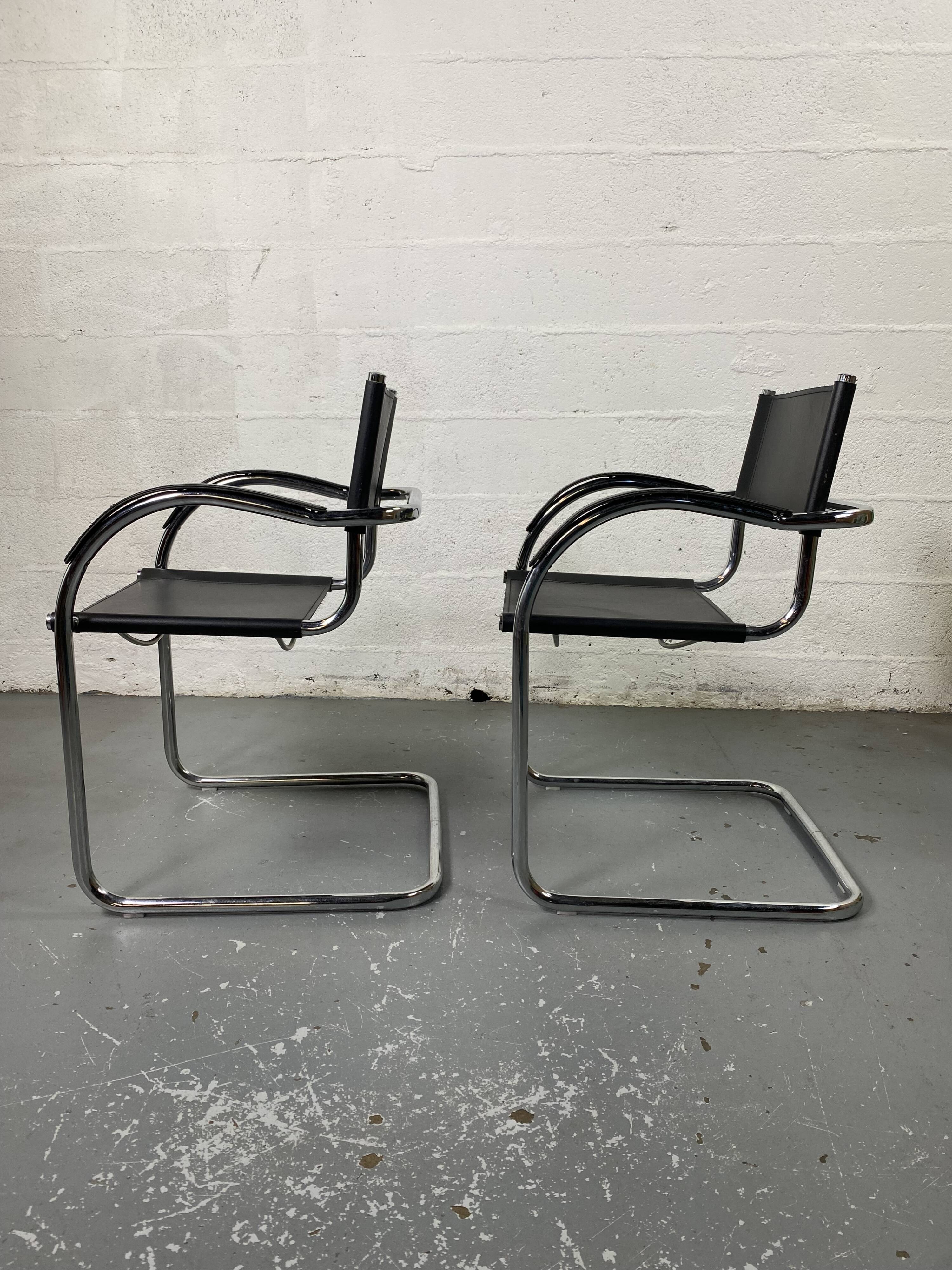 Pair of design armchairs in imitation leather chrome