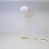 Mid-century floor lamp in brass and oak by Falkenbergs Belysning, Sweden, 1960s.