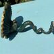 Antique candlestick base – stylised marine fish in patinated bronze