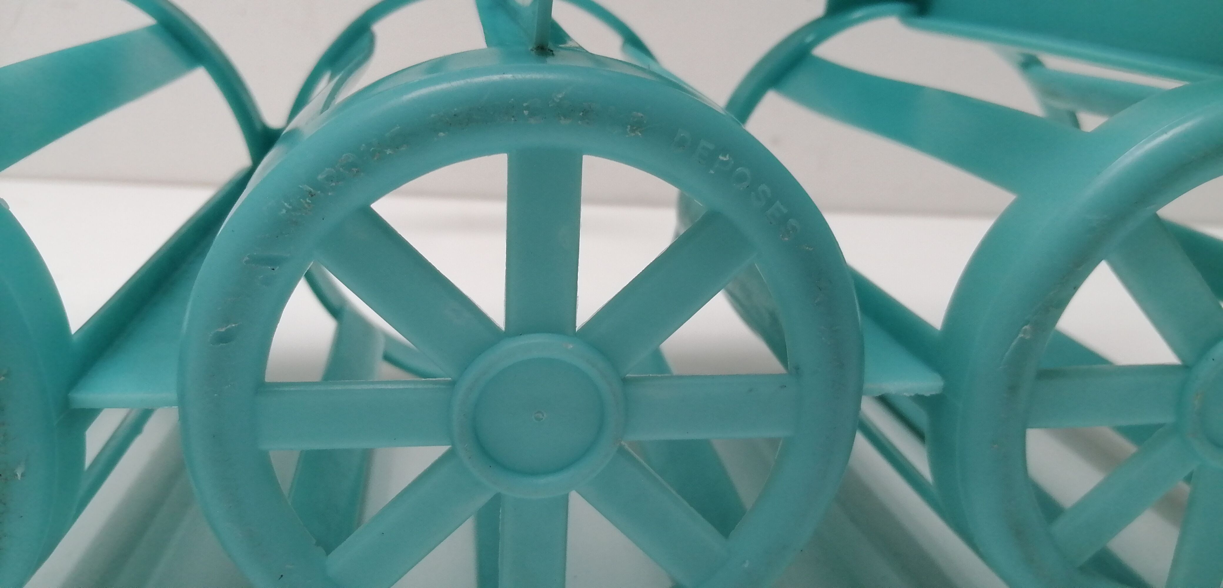 Vintage blue plastic bottle holder