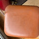 Brown folding chair in vinyl and steel