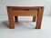 Monopoly-style elm bedside table regain