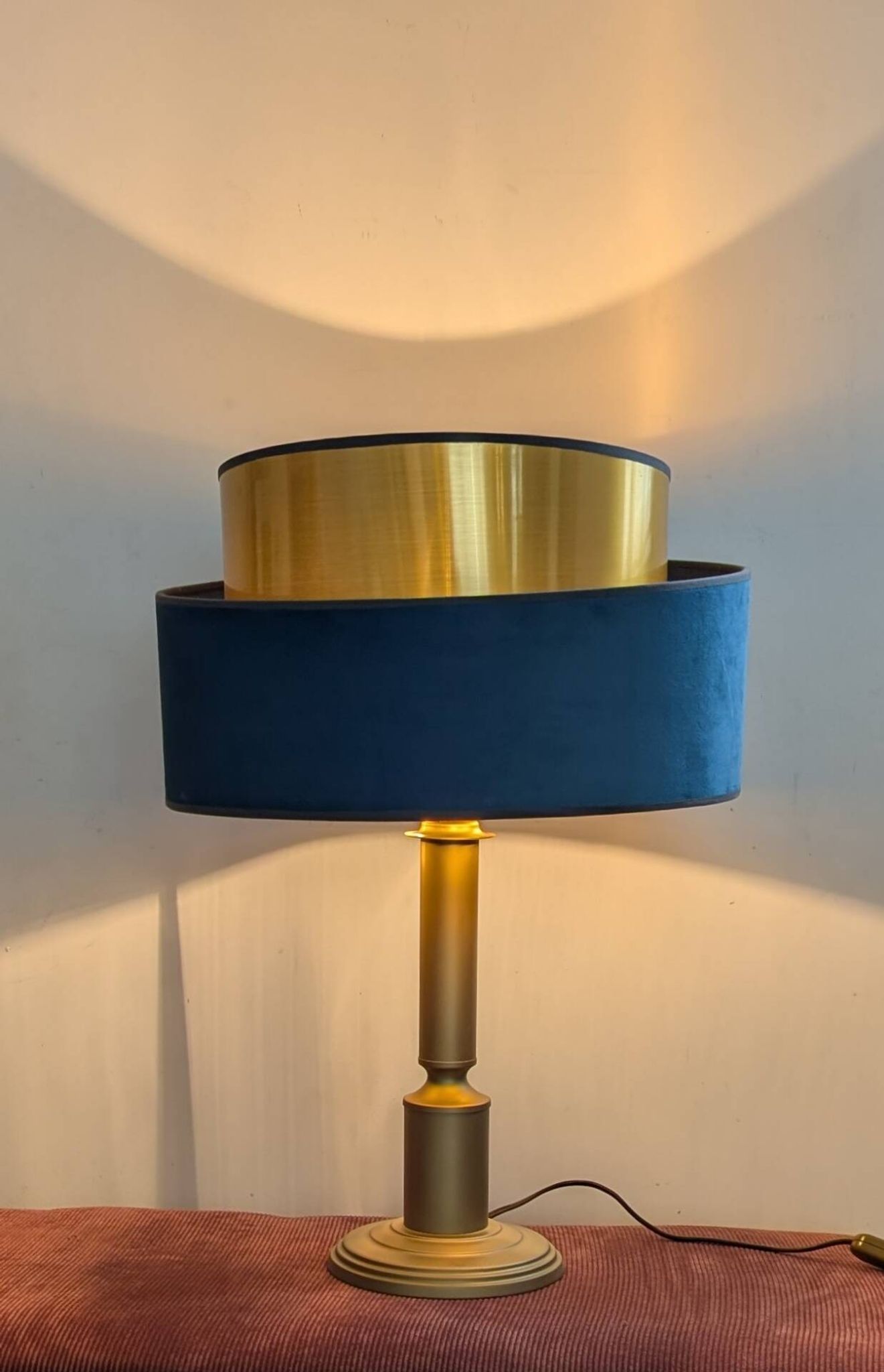 Brass lamp with asymmetrical velvet shade