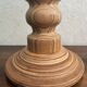 Wooden turned totem lamp with a linen shade in a vintage Scandinavian style.