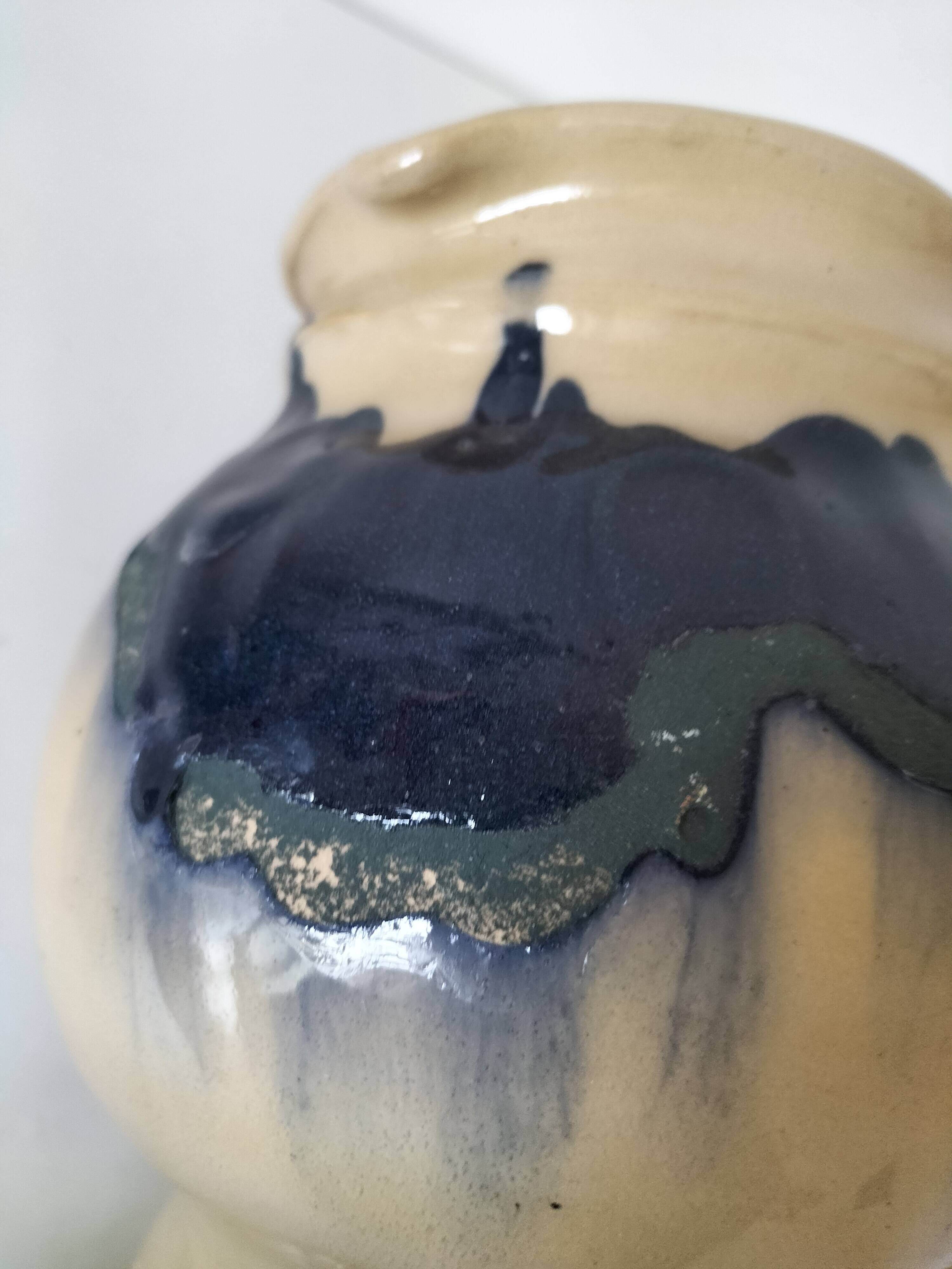 handcrafted ceramic jug with navy blue drip glaze.