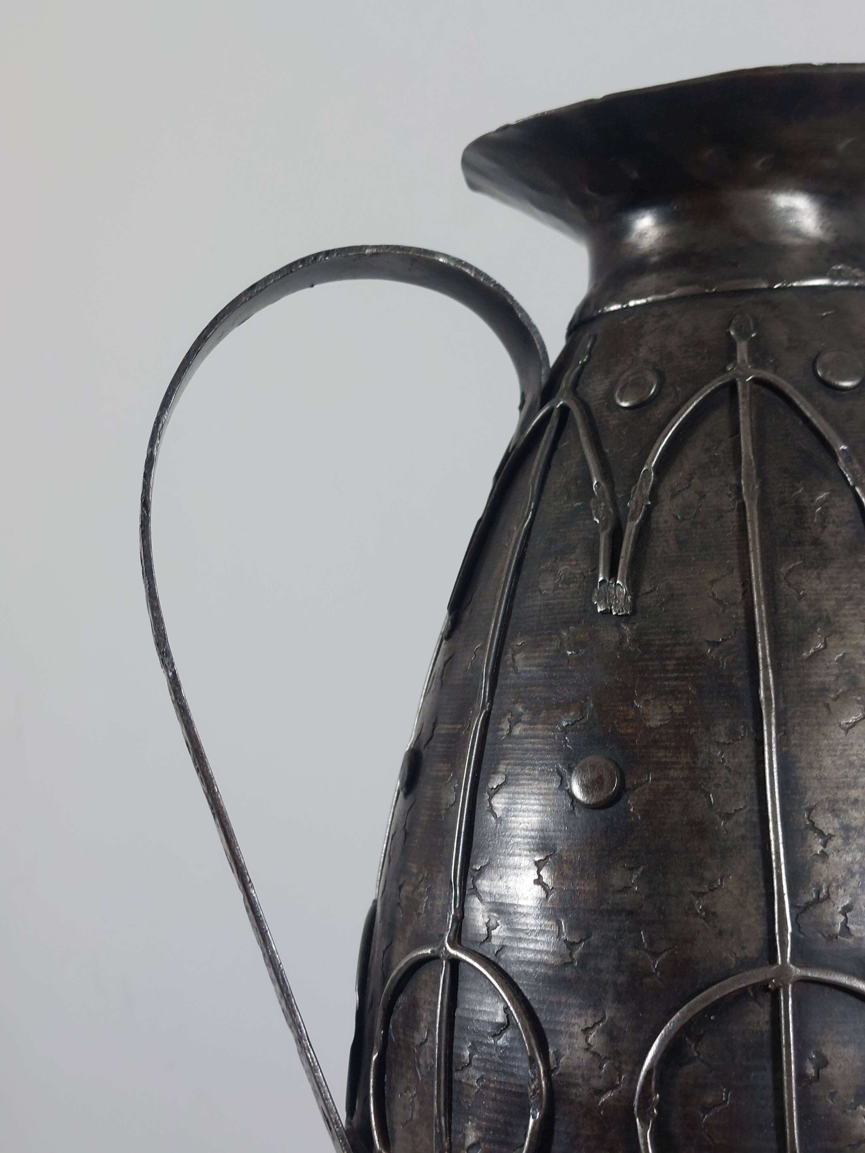Rare hand-forged metal pitcher and craftsmanship from France.