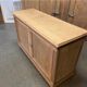 Two-door raw oak sideboard