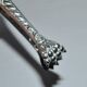 Rocaille sugar tongs in silver metal with lion claw medallion