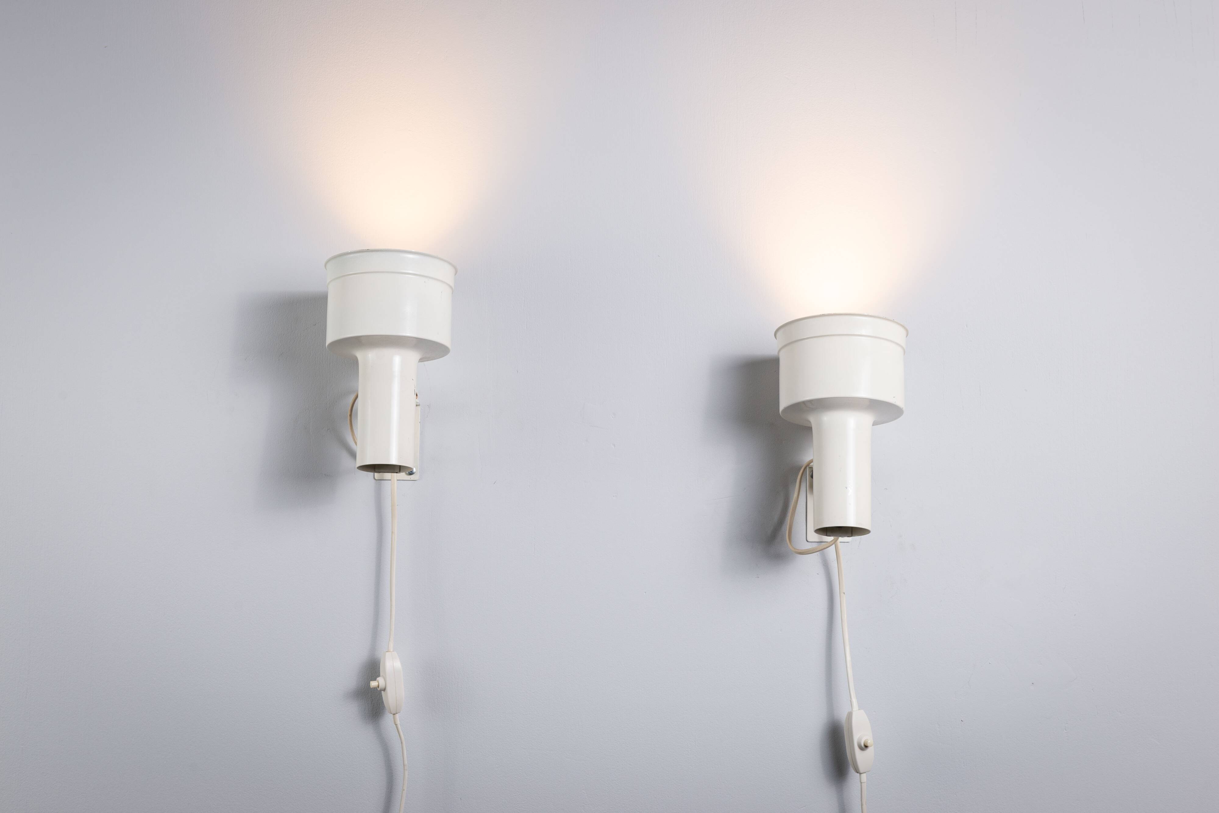 Pair of adjustable wall lamps designed by Per Sundstedt for Kosta Lampan