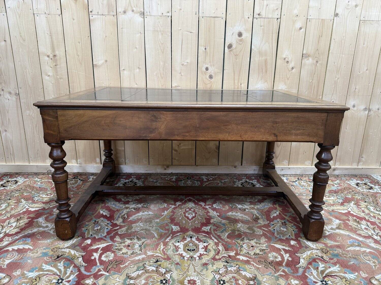 Flat desk in Louis XIII style made of walnut and leather.